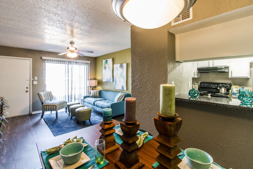 Model dining room with view of the kitchen at Sundance Apartments in College Station, Texas