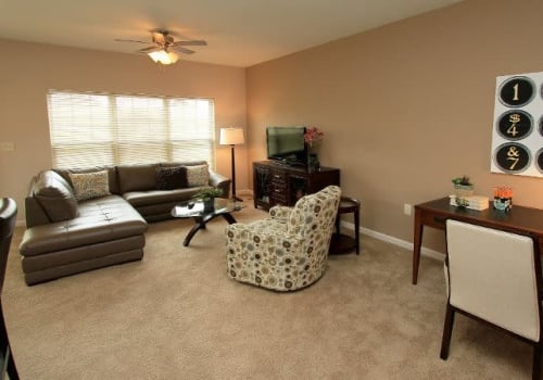 Bright, spacious living room at Preserve at Autumn Ridge in Watertown, New York