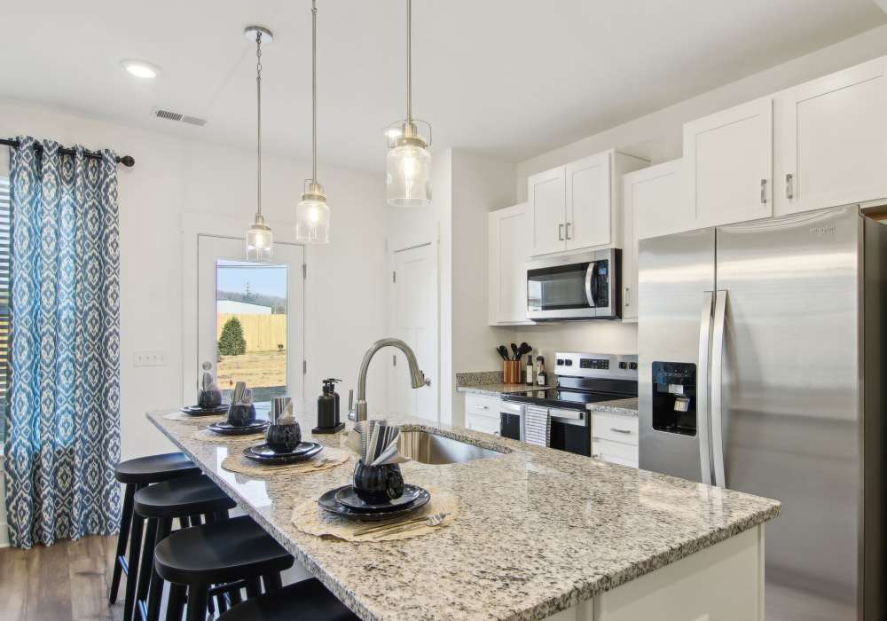 Kitchen with an island at Artisan Living Mills River in Mills River, North Carolina