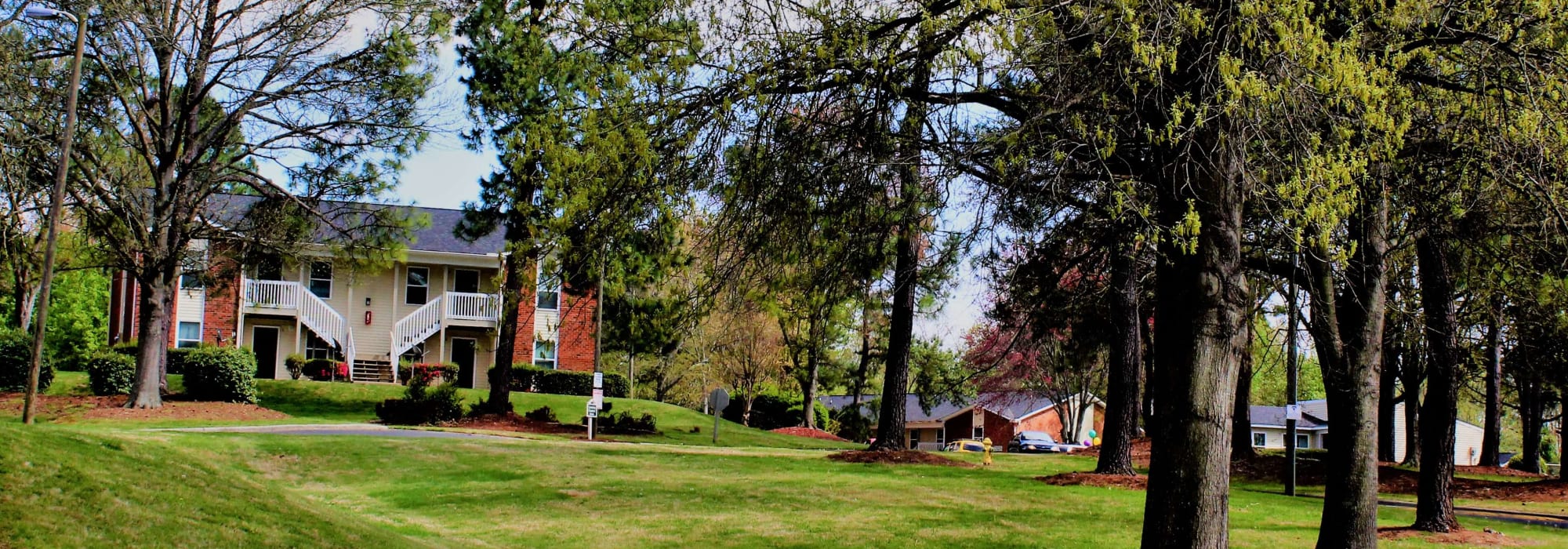 Landscaping surrounding apartment buildings at Arborgate Apartments Homes in Charlotte, North Carolina