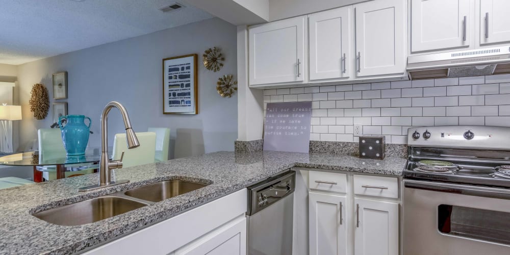 Granite countertop in an apartment kitchen at Hickory Creek in Henrico, Virginia