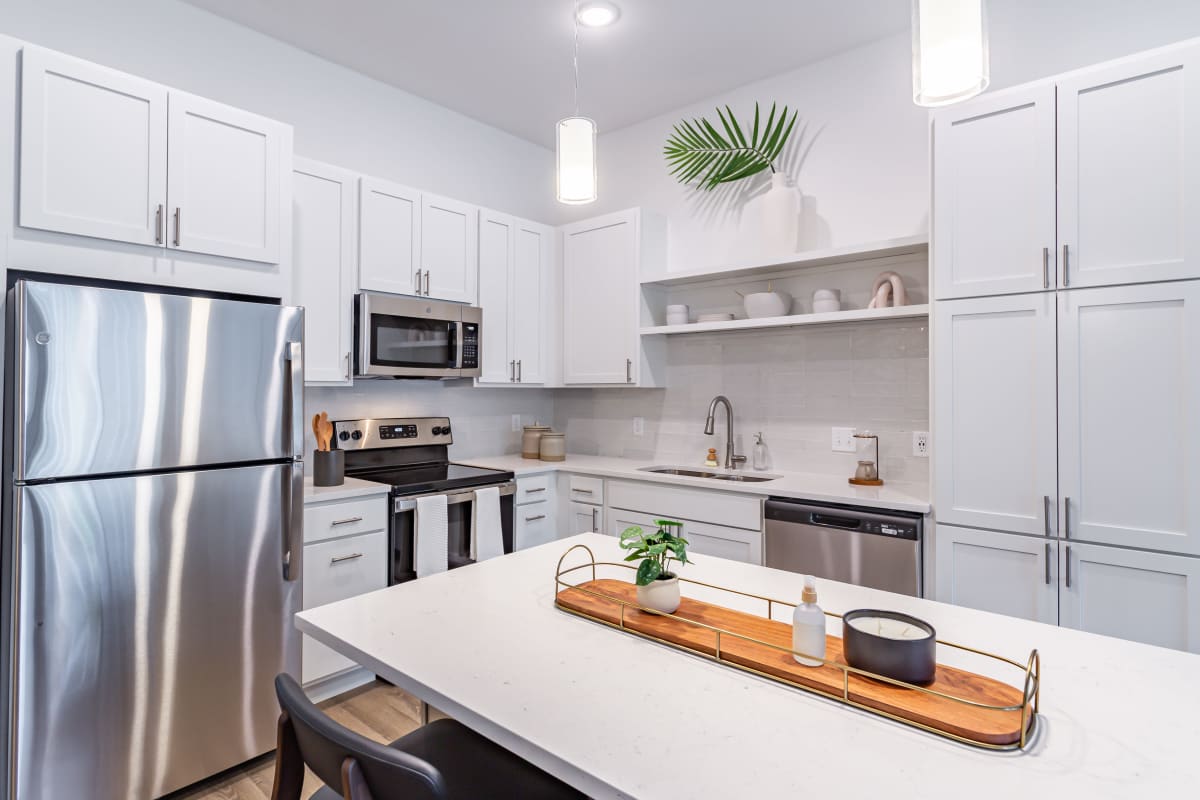 Apartment kitchen with stainless-steel appliances at The Ellie in Eden Prairie, Minnesota