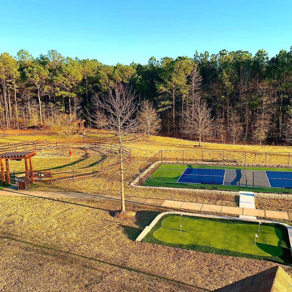 View of dog park, pickleball court and putting green at Preserve At Columbus Park in Columbus, Georgia