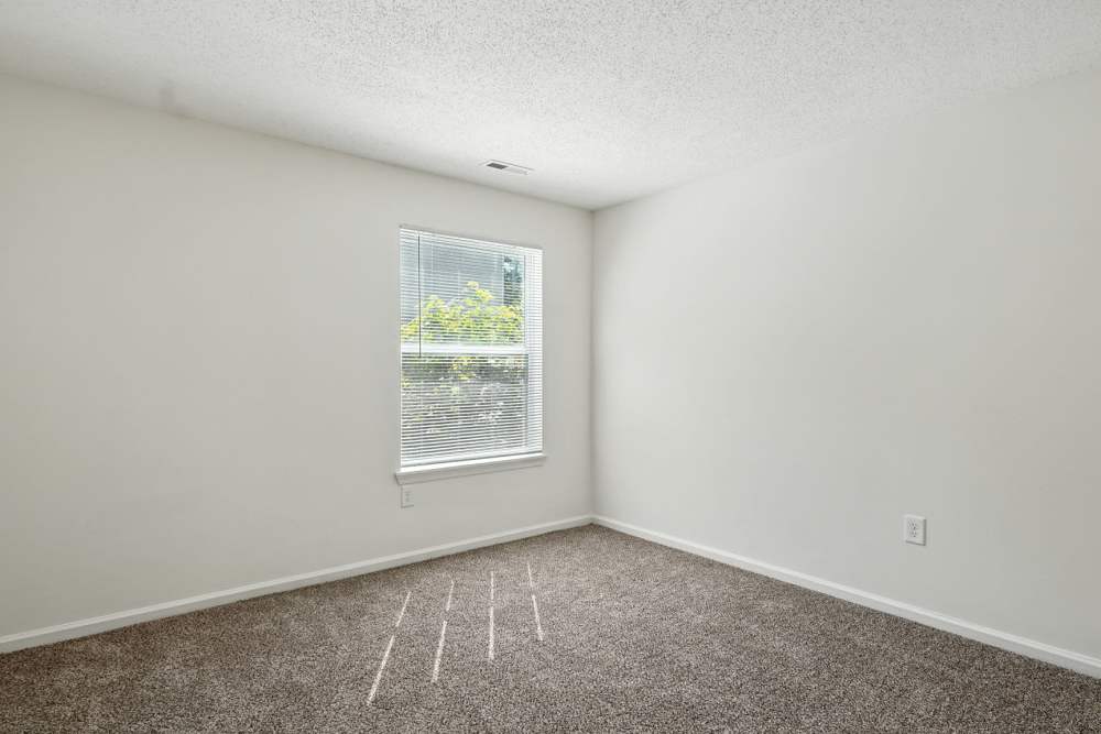 Bedroom with windows at Monmouth Woods in King George,Virginia