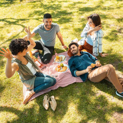 Happy residents in the park at Mill Creek Apartments in Cross Plains, Wisconsin