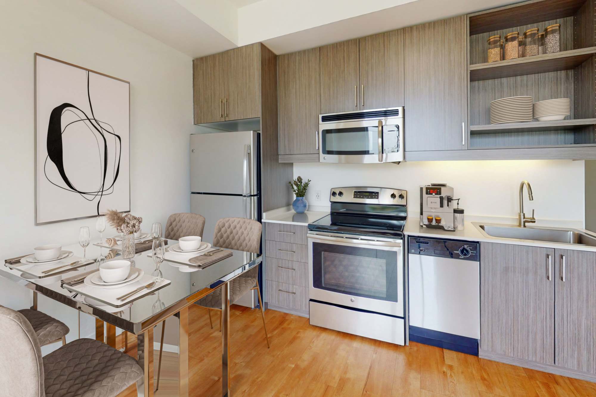 A kitchen with stainless-steel appliances, refrigerator, wooden cabinets at The Union in Portland, Oregon