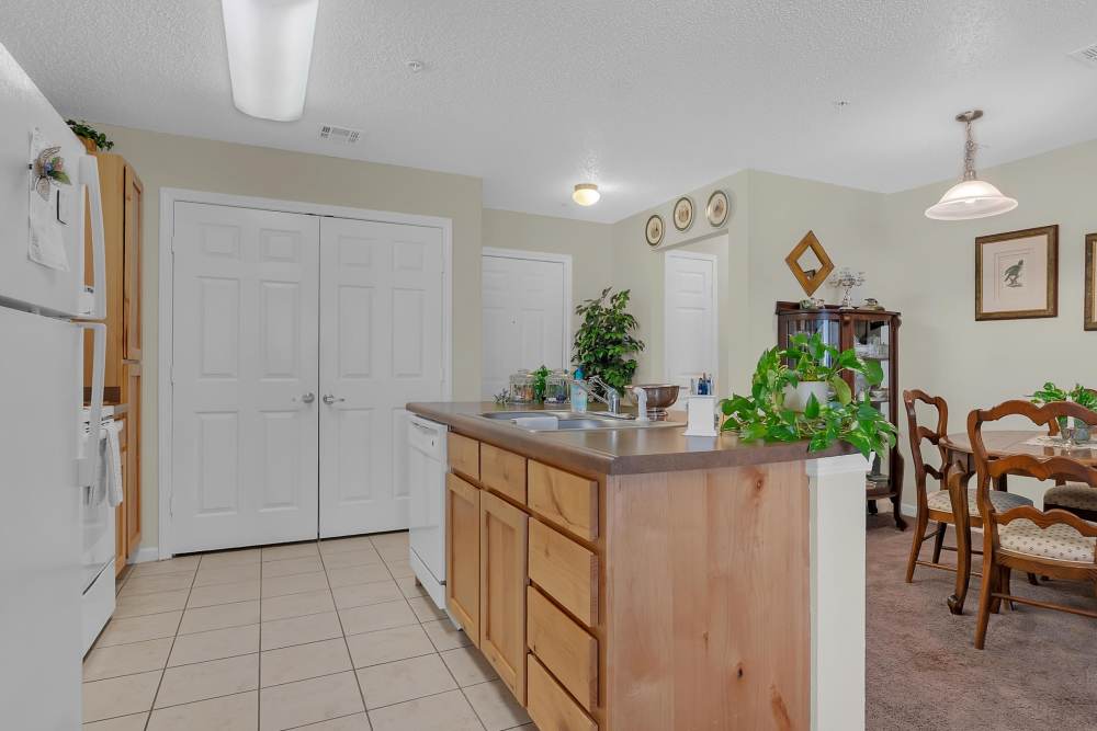Kitchen with dishwasher at Hartford Villas in Broken Arrow, Oklahoma