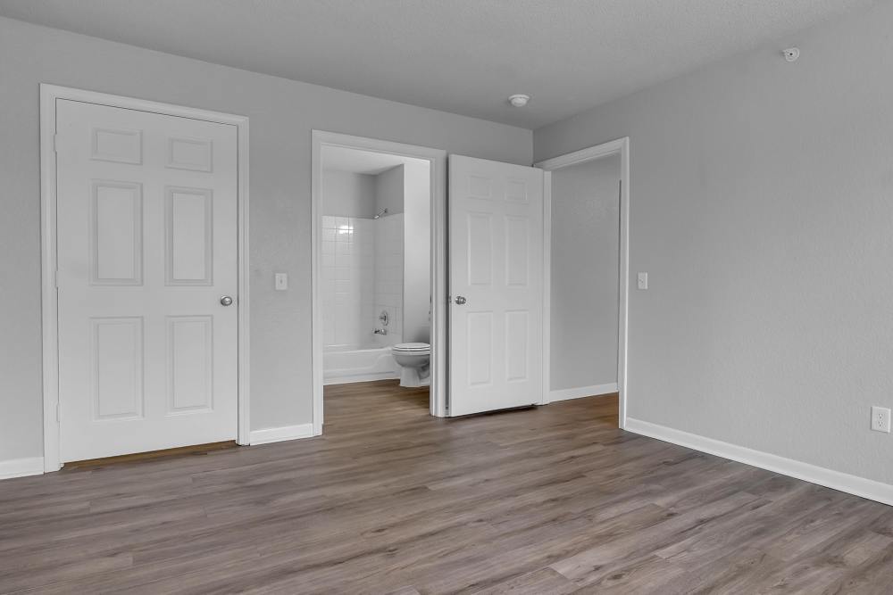 Unfurnished master bedroom with access to bathroom at Garden Courtyards in Tulsa, Oklahoma