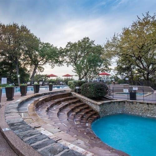 Layered levels of brick leading to water at Verandahs at Cliffside Apartments in Arlington, Texas