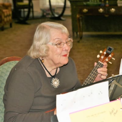 Resident playing music at Ebenezer Ridges Campus in Burnsville, Minnesota