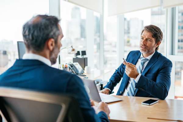 two mean discussing business