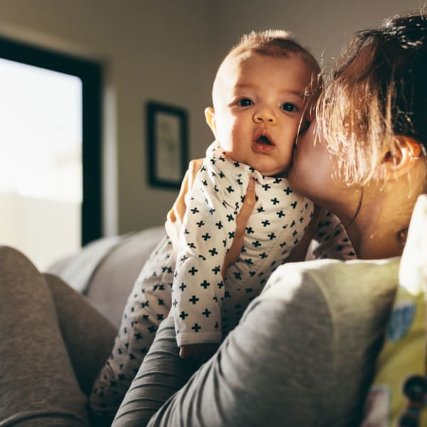 A mother holds her baby at The Cascades, Virginia Beach, Virginia