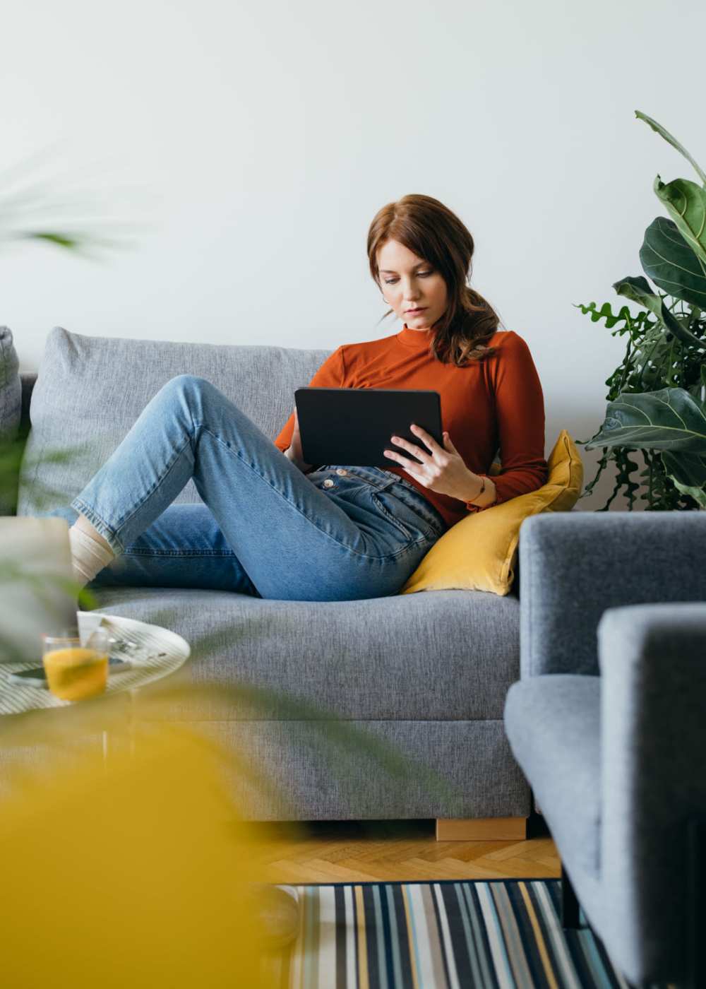 Resident woman using her laptop at Cottages at Craft Farms in Gulf Shores,Alabama