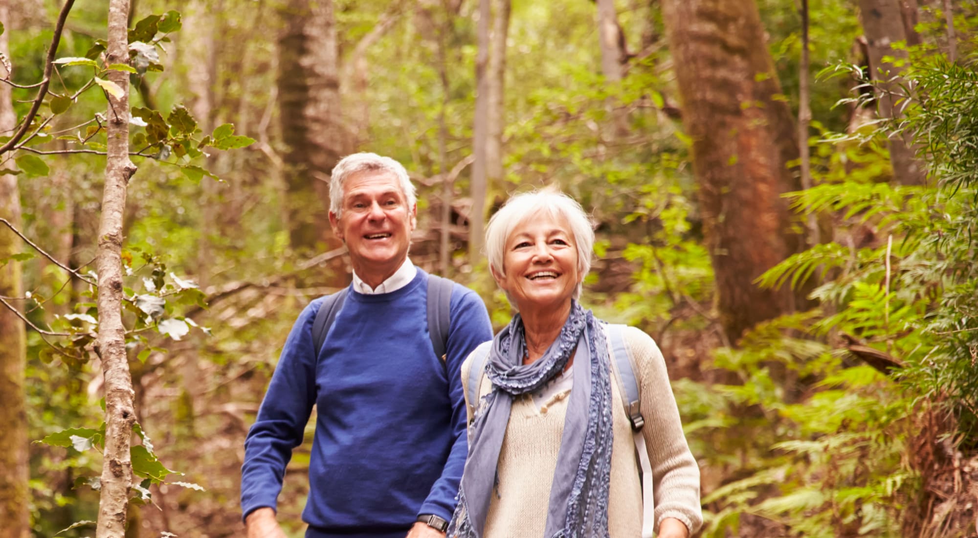 Residents out on a wooded hike near Lassen House Senior Living