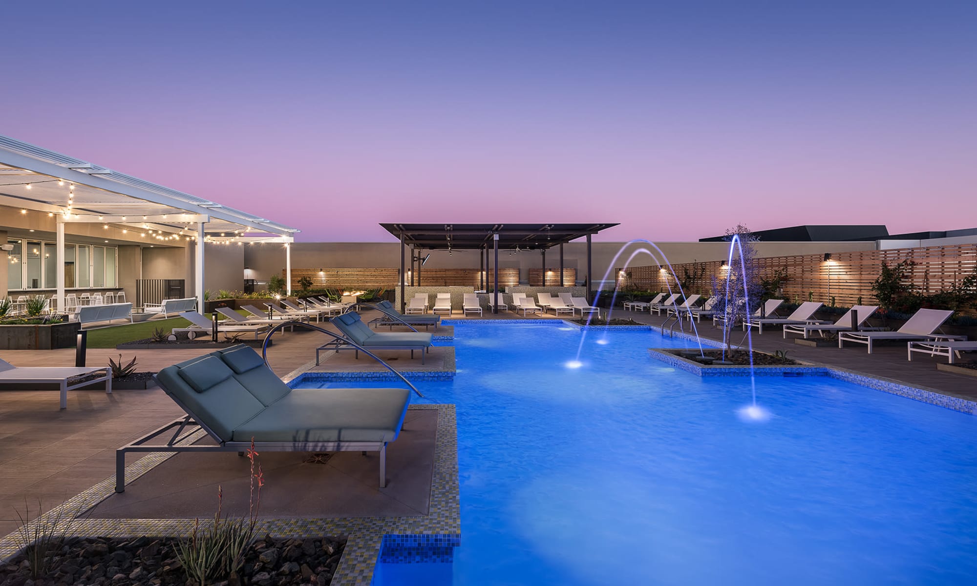 Resort-style swimming pool and outdoor amenity area at The Piedmont in Tempe, Arizona