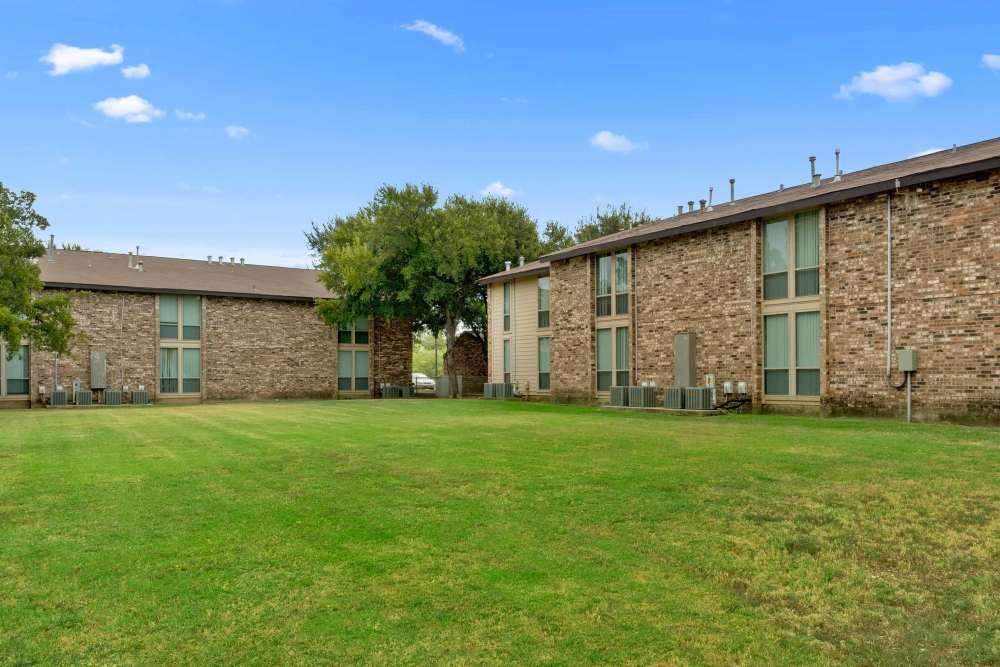 Beautiful courtyard and apartments view at Woodland Village Apartments in Breckenridge, Texas
