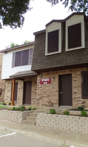 Two story townhome with parking at Round Rock Townhomes in Arlington, Texas