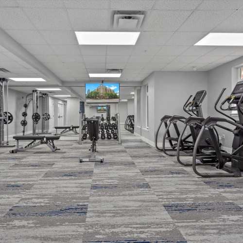 Well-equipped fitness center with cycles and weight-lifting machines at The Kensington in Charlotte, North Carolina