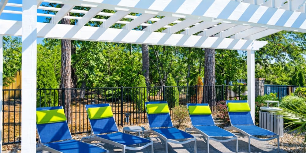 Lounge chairs by the pool at Belle Meade in Wilmington, North Carolina