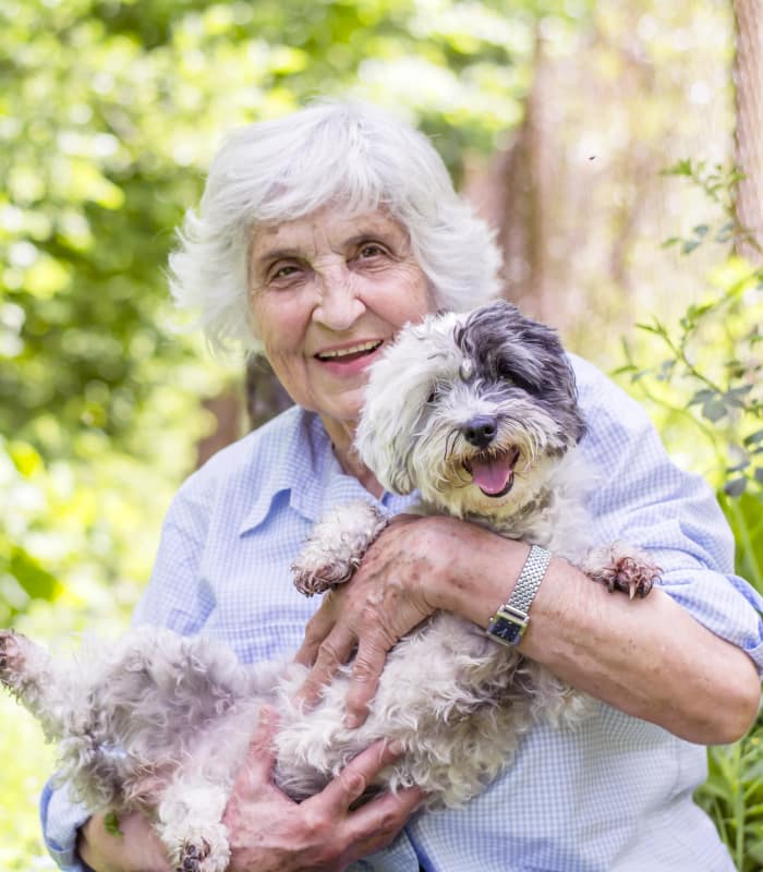 Resident with dog at The Retreat at Sunny Vista in Colorado Springs, CO
