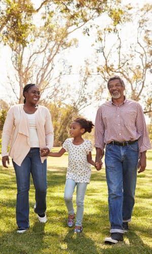 Residents enjoying a stroll together outside at The Majestic at Hewitt in Hewitt, Texas