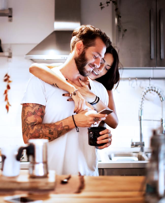 Couple loving their new gourmet kitchen at The Wayland in St Petersburg, Florida