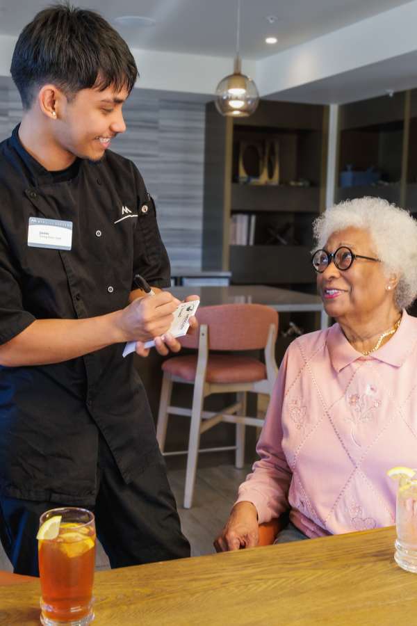 Server with resident at Merrill Gardens Tukwila