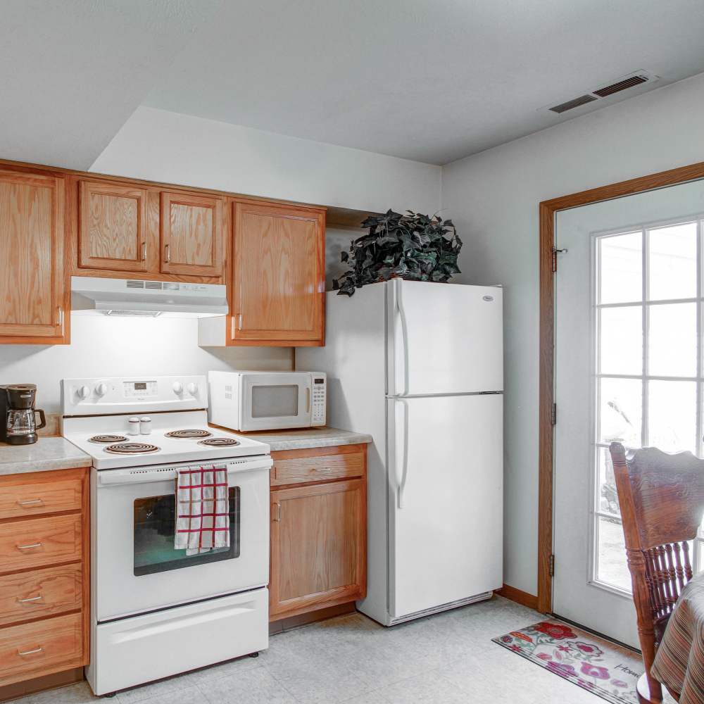 A kitchen with white features at Hallet Crossing in Michigan Center, Michigan