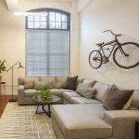 Well-furnished living area at Lofts at Inman Mills in Inman, South Carolina