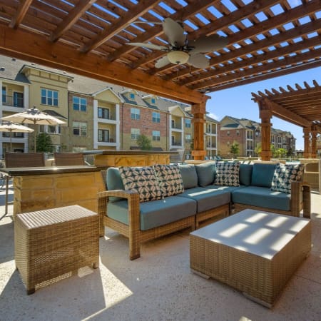 Shaded pavilion with lounge seating at Auberge of Burleson in Burleson, Texas