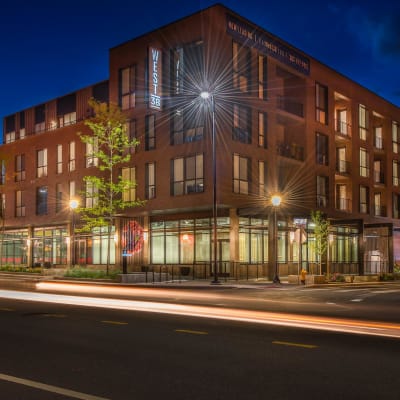 View of exterior at night at West 38 in Wheat Ridge, Colorado