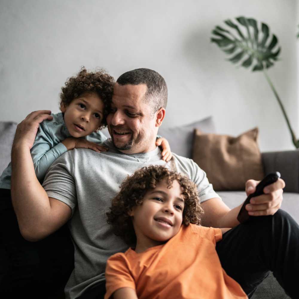 Resident with his kids at Tucasa Townhomes in Irving, Texas