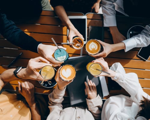 Friends enjoy coffee near University Lofts at Greensborough Village, Jonesboro, Arkansas