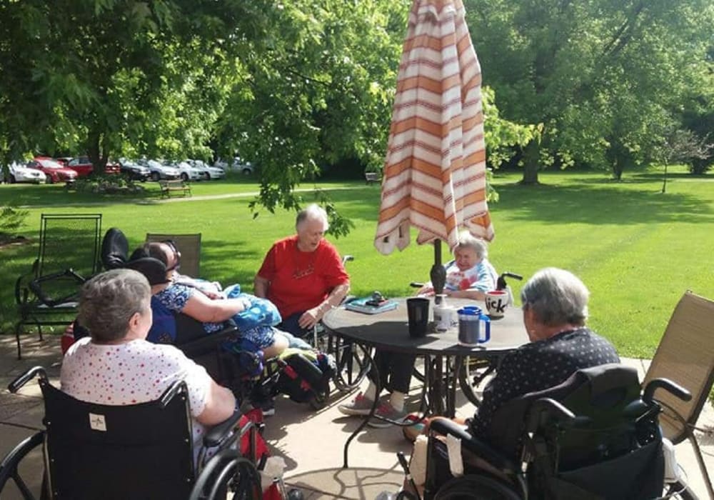 Residents enjoying time outside in the sun at Geneva Lake Manor in Lake Geneva, Wisconsin