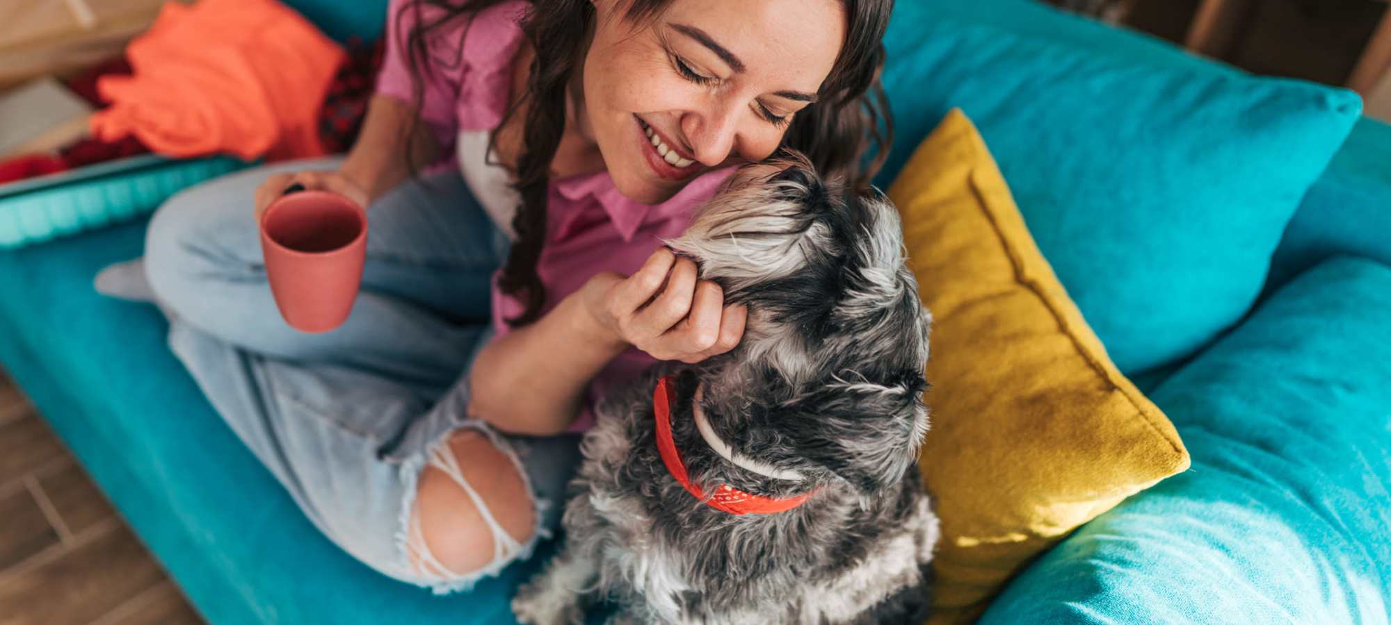 Resident playing with her dog at AMP Residential in Grand Rapids, 