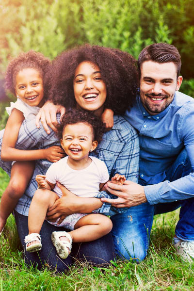 Family posing happily at Retreat at Stonecrest in Lithonia, Georgia