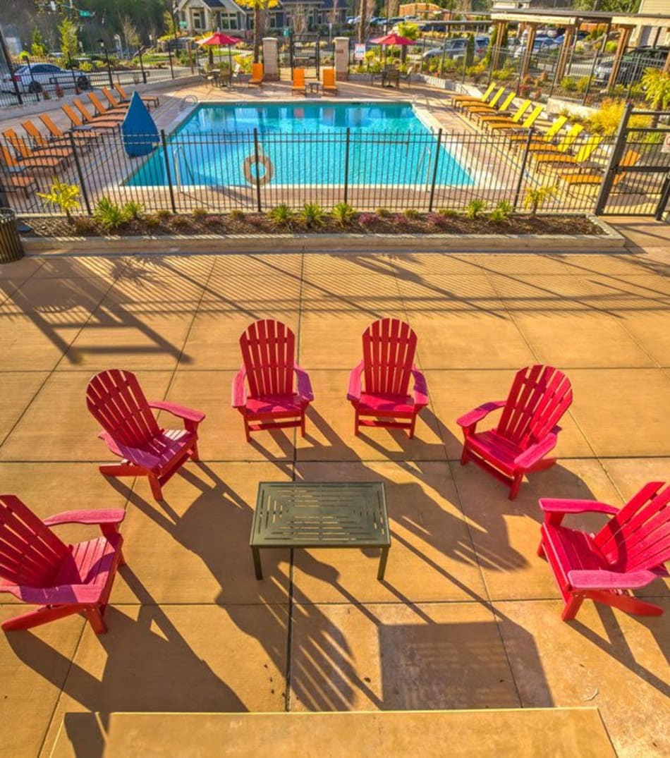 Aerial view of the fire pit deck with surrounding seating overlooking the pool area at Vue Issaquah in Issaquah, Washington