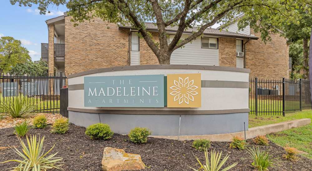 Outdoor property signage at The Madeleine in Fort Worth, Texas 