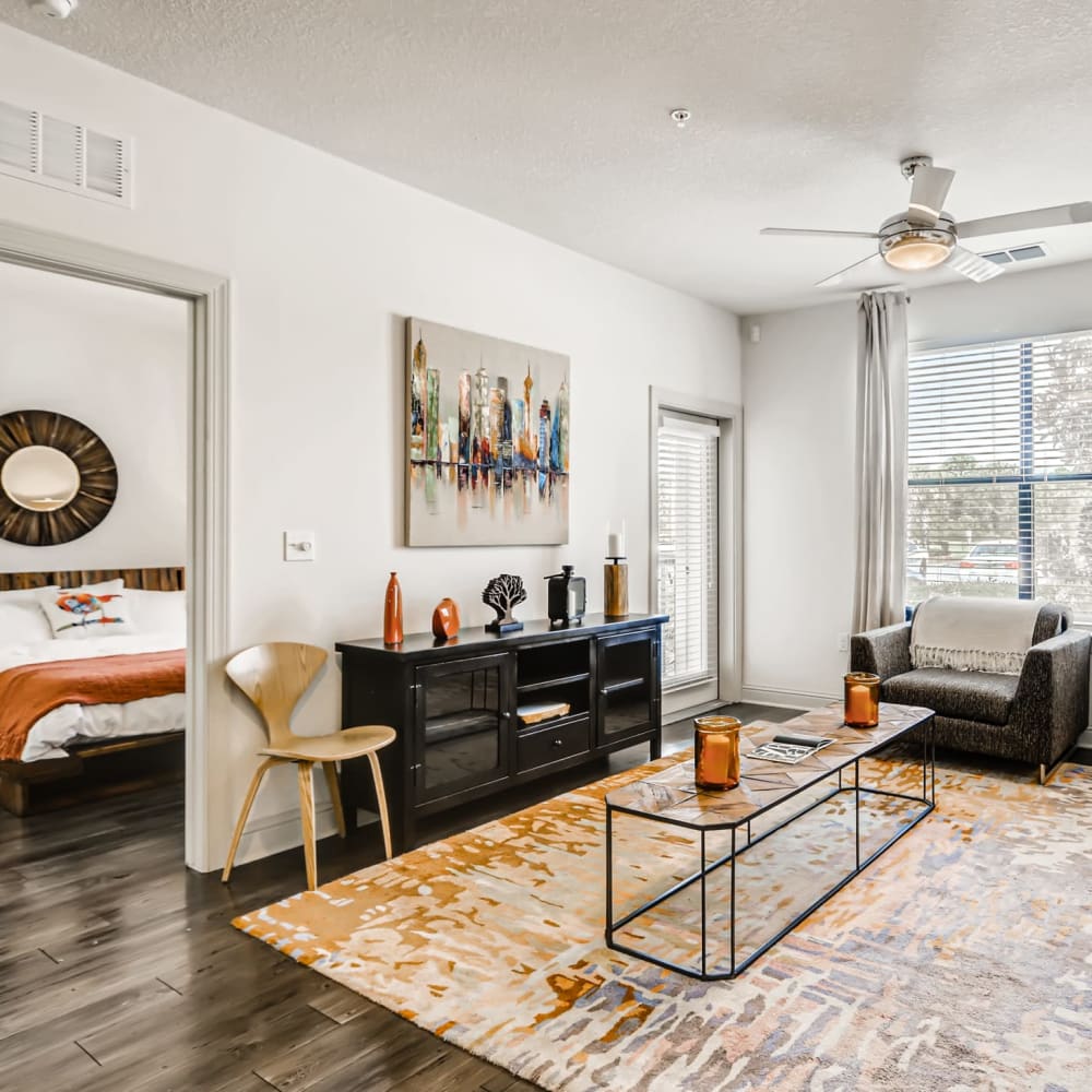 A furnished apartment living room and bedroom at EOS in Orlando, Florida