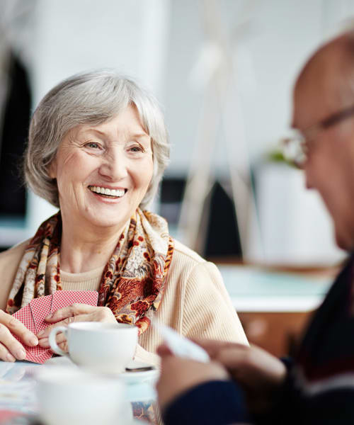 Residents playing cards at The Springs at Lancaster Village in Salem, Oregon