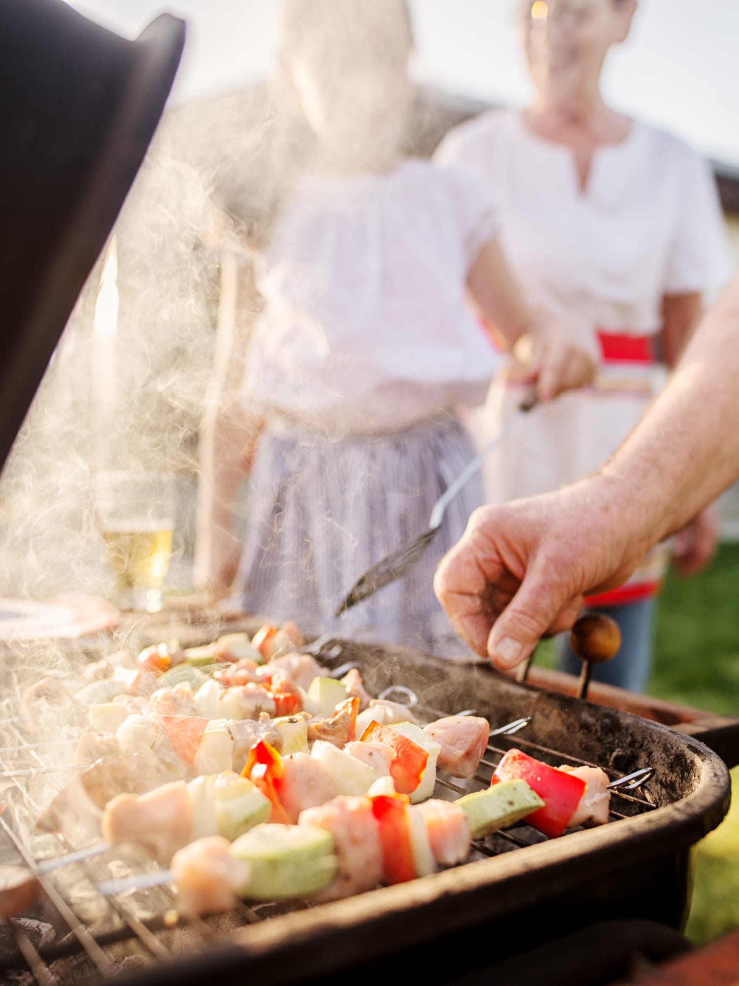 Residents grilling at the outdoor picnic area at Monroe Terrace Apartments in Monroe, Ohio