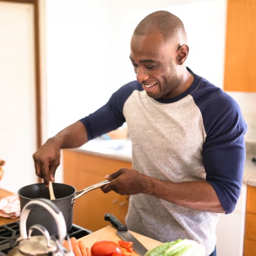 A resident cooking at On Base Housing in Yuma, Arizona