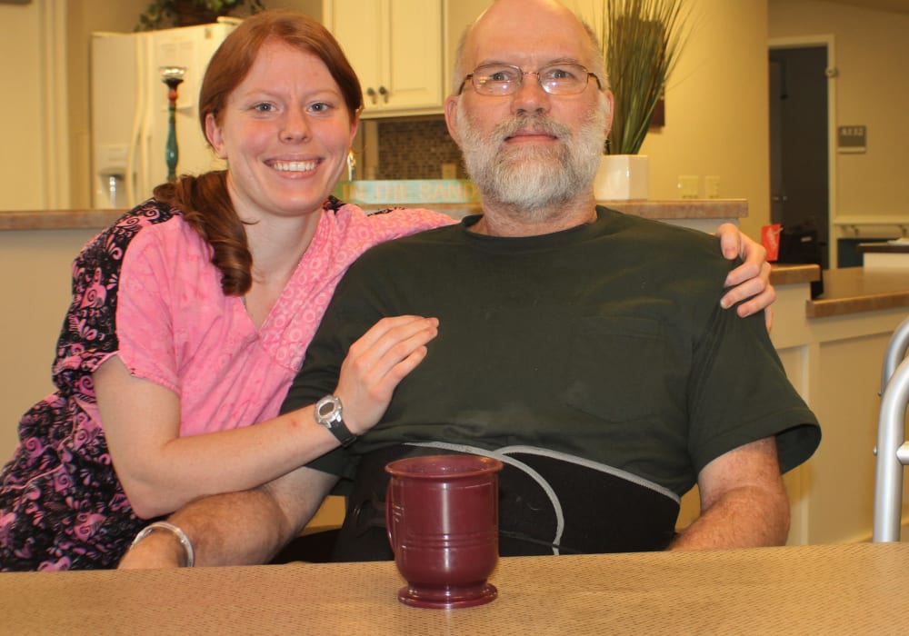 Resident and caretaker posing for a photo at Holton Manor in Elkhorn, Wisconsin