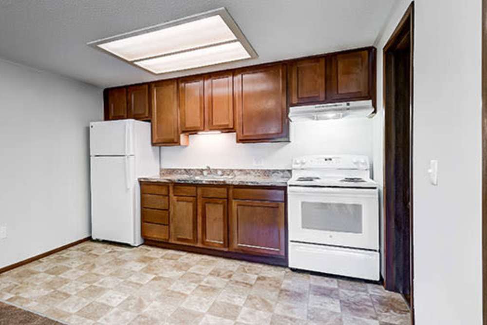 Kitchen with appliances at Little Brook Apartments in Frederick, Maryland