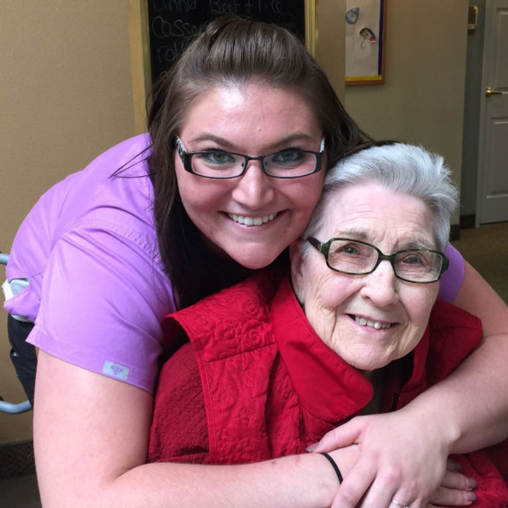 A resident and caregiver at The Ridge at Lansing in Lansing, Michigan