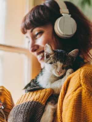 Resident spending time with her cat in their high-end pet-friendly home at Biltmore at the Park in Pflugerville, Texas