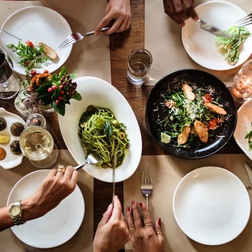 Residents dining together at a gathering at Bayview Hills in San Diego, California