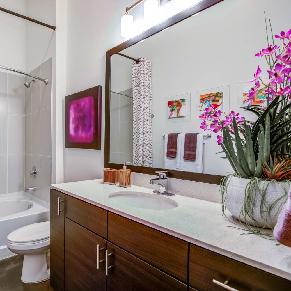 Master bathroom with purple accents at Mercury NoDa in Charlotte, North Carolina