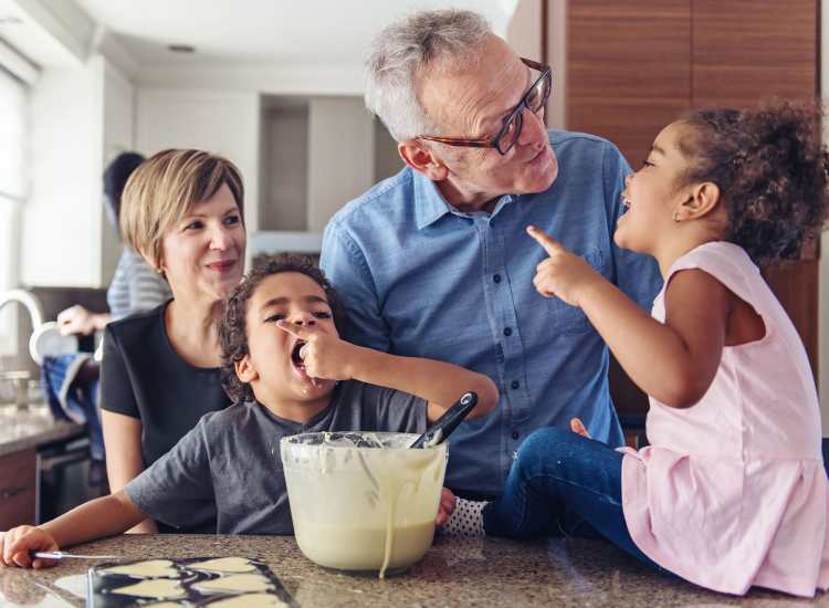 A happy resident family cooking in their apartment home at Acushnet Commons in New Bedford,Massachusetts