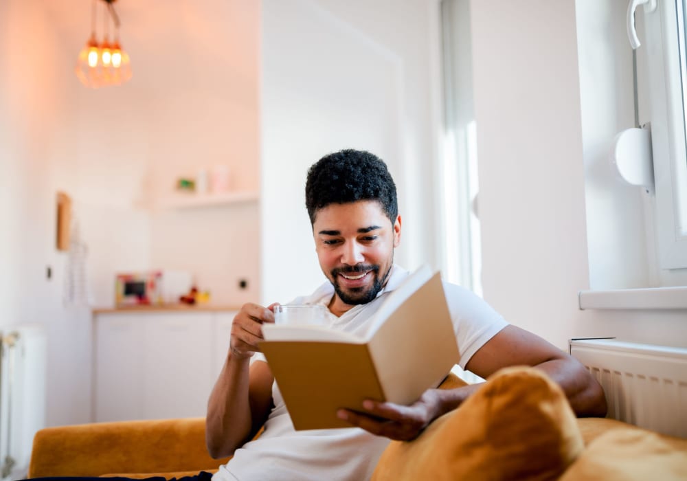 Resident reading a book at Nottingham Manor in Montvale, New Jersey